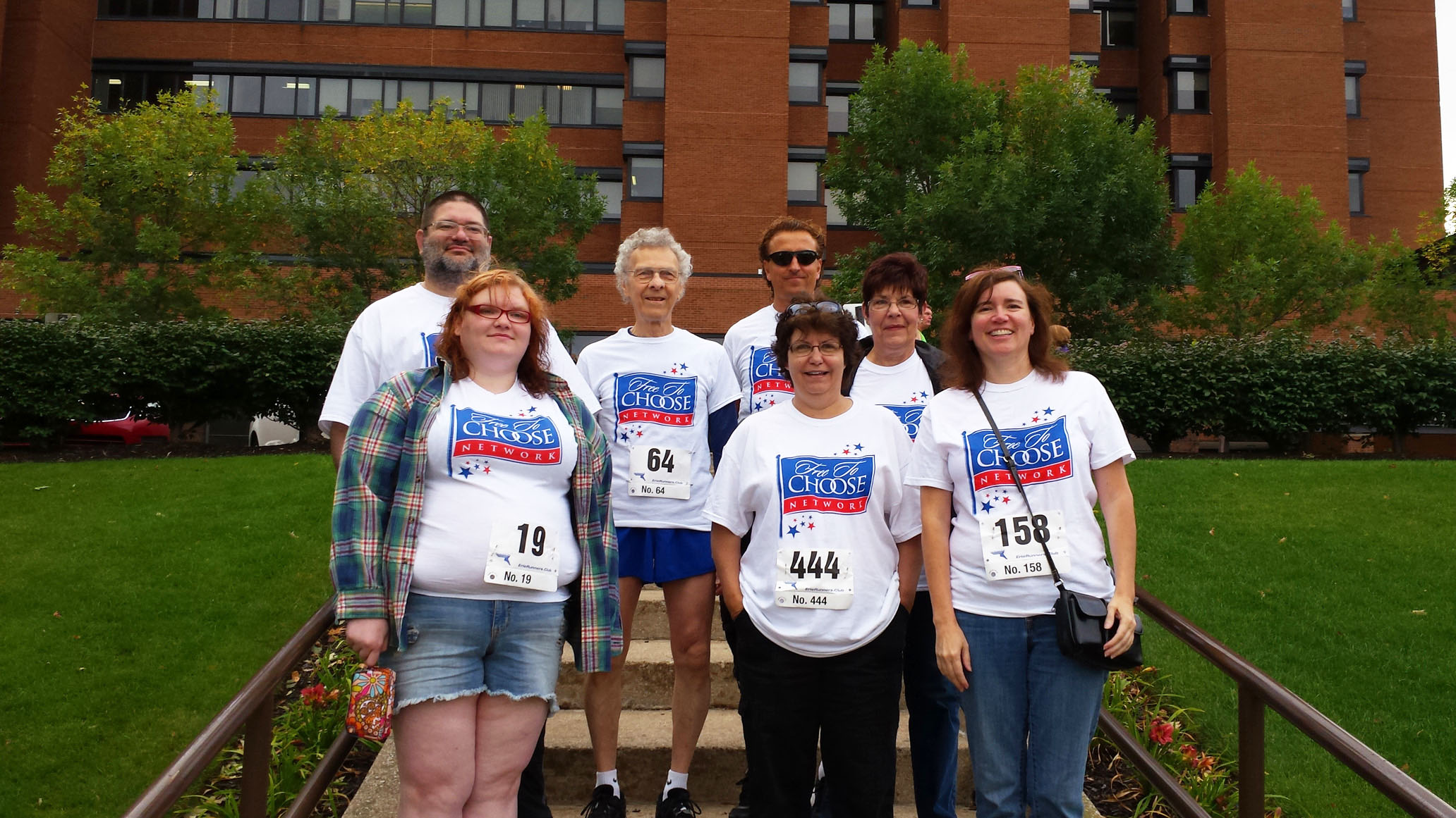 Employees of Free To Choose Network: Bobby Range, Bob Chitester, Michael Kraus, granddaughter Emily Behrendt, Tara Schupp, Ellen Woodward, and Susan Gable, who joined Bob in the UPMC Hamot Hospital's 10k Mayor's Cup in 2014.