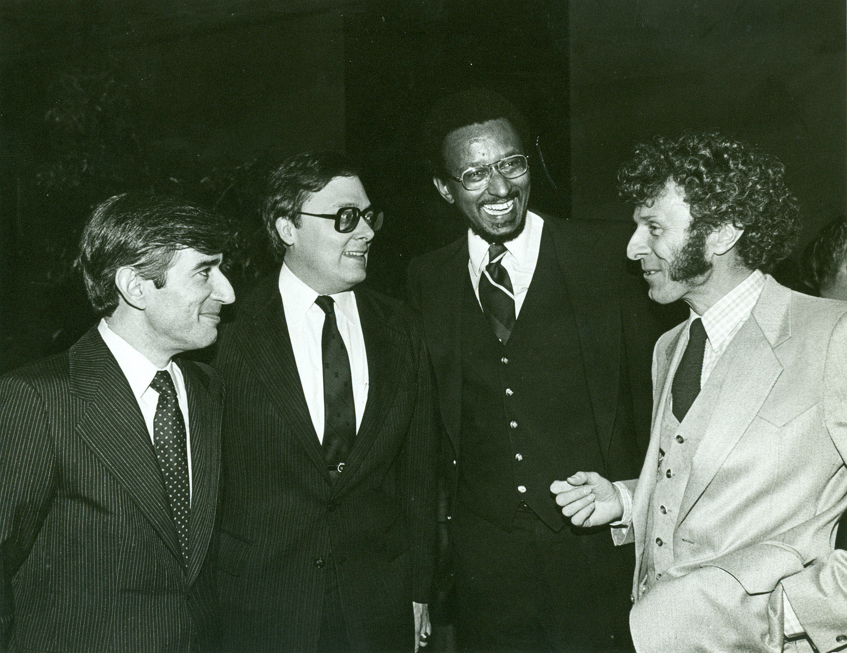 Bob and his sideburns have been friends with Walter Williams for many years. Here, Bob regales Walter, Ed Feulner, and Don Lambro with producing tales.