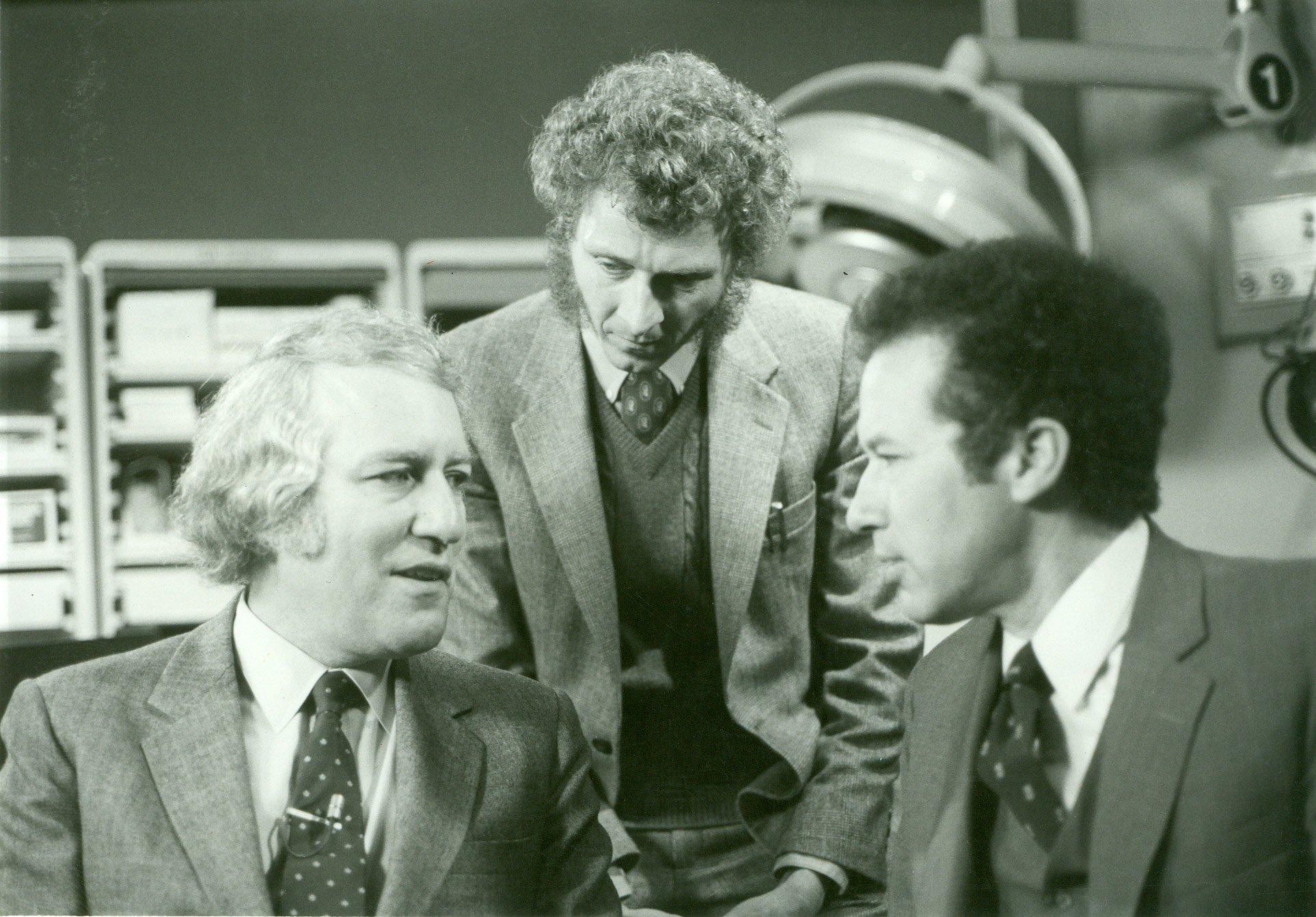 From left to right: Louis Rukeyser, Bob Chitester, Walter McClure, while filming Money and Medicine production shots at AMSCO in Erie, PA.