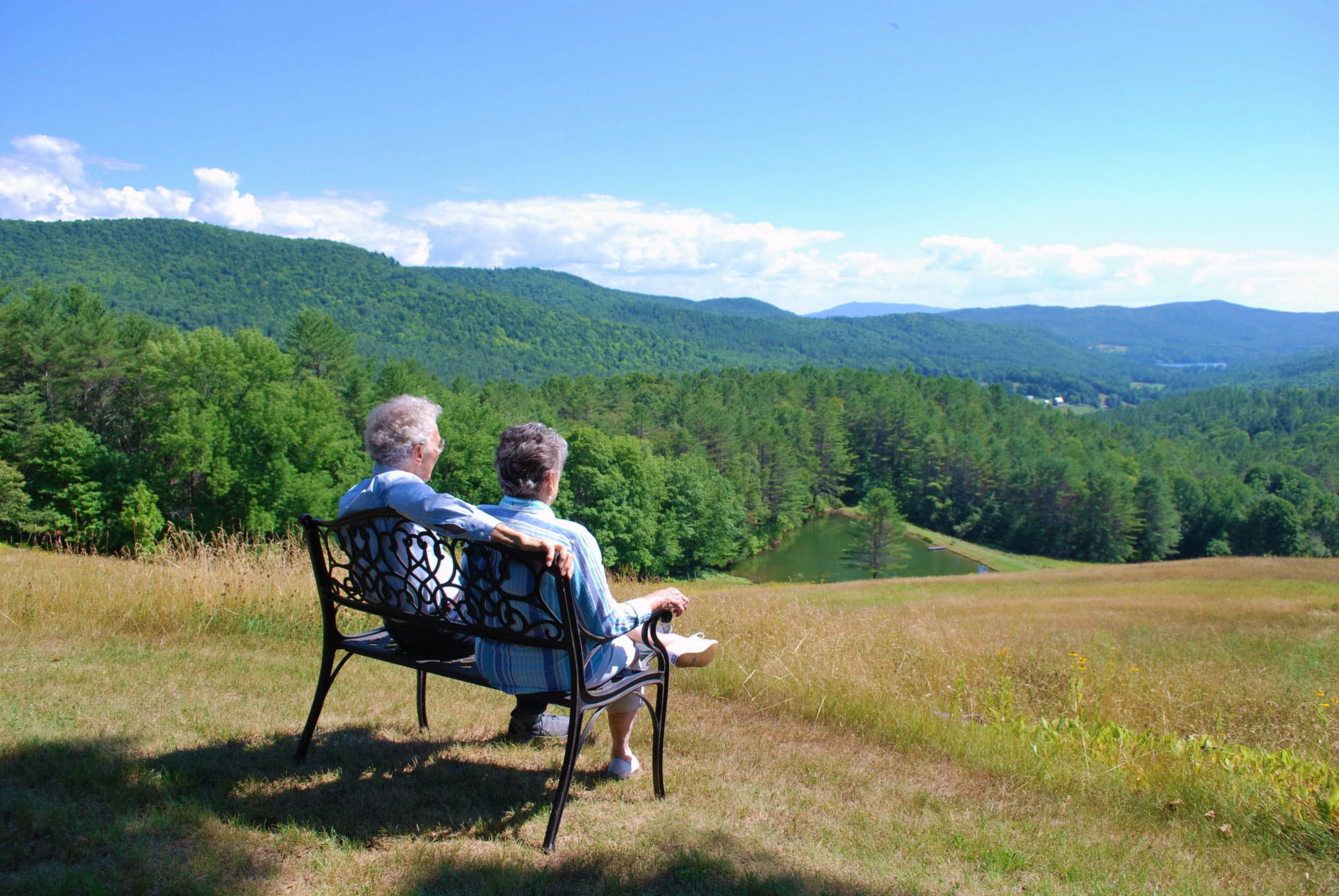 Replicating the photo of Milton and Rose Friedman, Bob and his wife Carol take in the view at Capitaf. Today, a bronze sculpture of Milton and Rose takes up the bench.