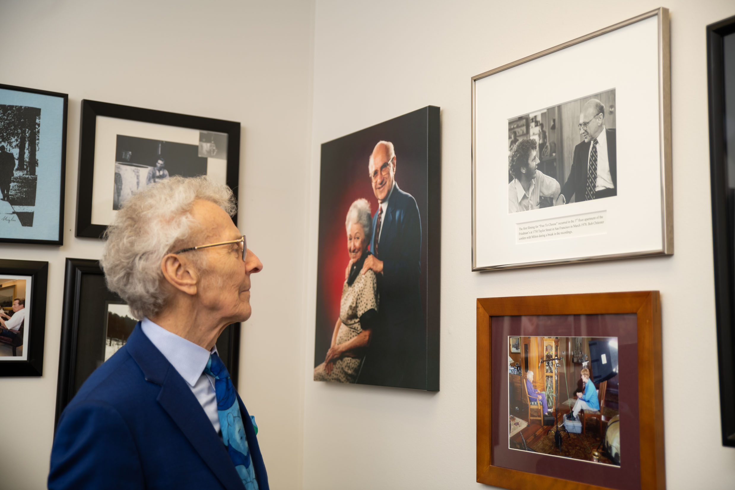 Bob stops in the office to gaze at his favorite photo of Milton Friedman and him.