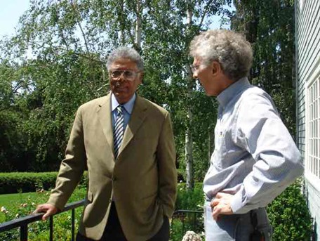 Famed author and economist Thomas Sowell and Bob step outside to take a break from filming.